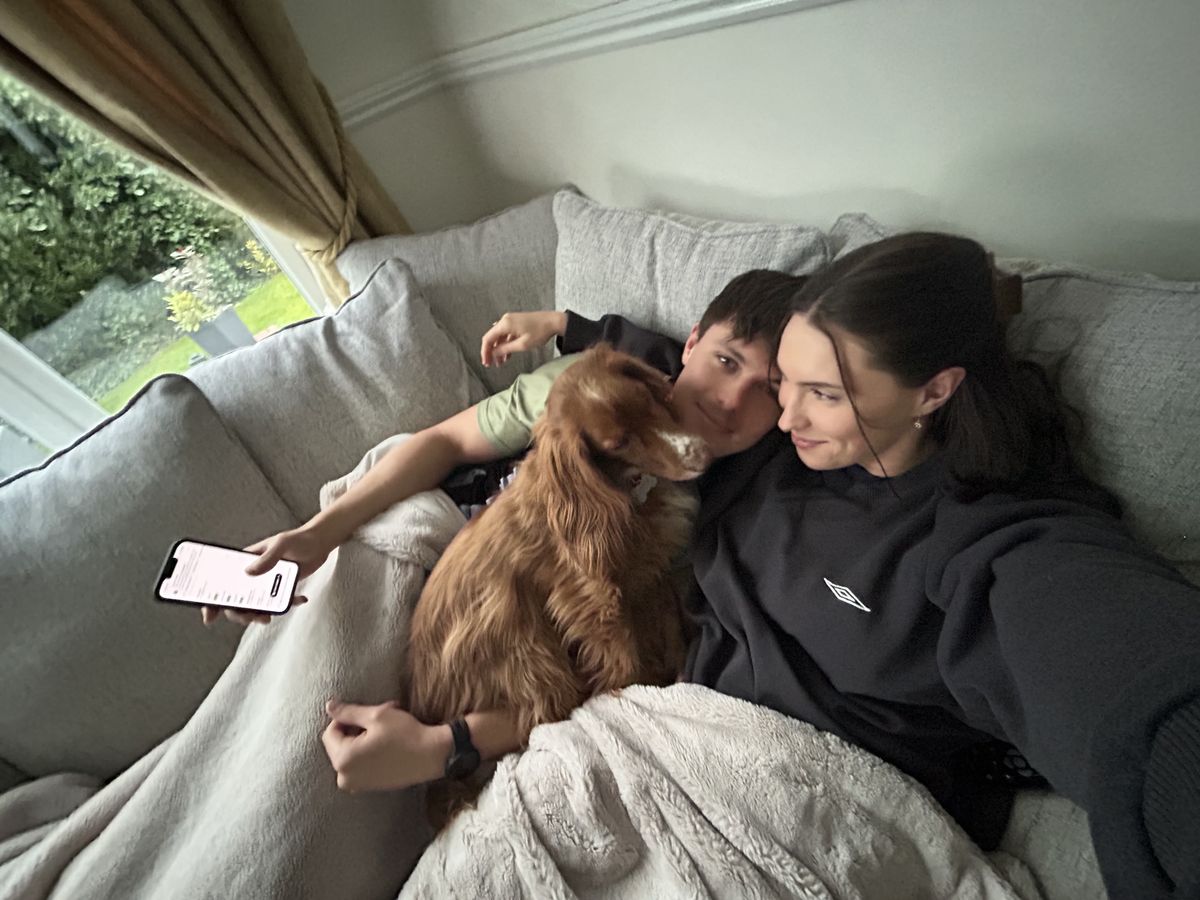 Chester the cocker spaniel cuddling on the couch