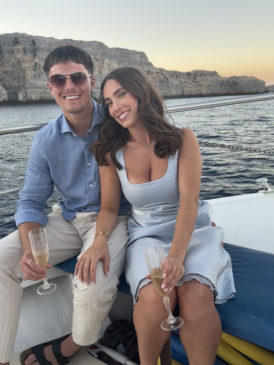 Callum and Niamh on a boat at sunset